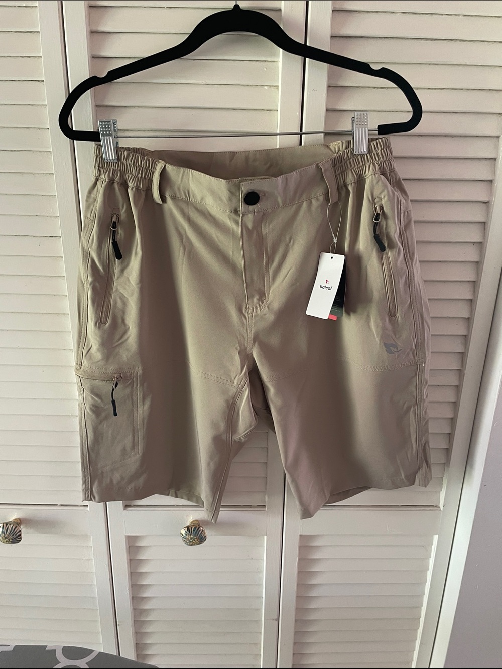 Baleaf Women’s Tan Performance Cargo Shorts with Zip Pockets. NWT
